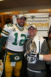 Green Bay assistant athletic trainer Nate Weir, a 2005 Central graduate, with quarterback Aaron Rodgers and the NFC Championship trophy following the Packers’ 21-14 win at Chicago in Sunday’s NFC title game.