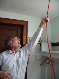 Jacob Lamb, seen here ringing the bell at the old church, helped to bring life back to the church, and with it the rural community of Poweshiek County