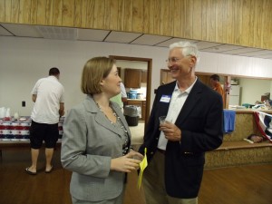 Brenna Findley and Guy Vander Linden catch up on recent State House events during the Poweshiek County Republican social event Friday evening