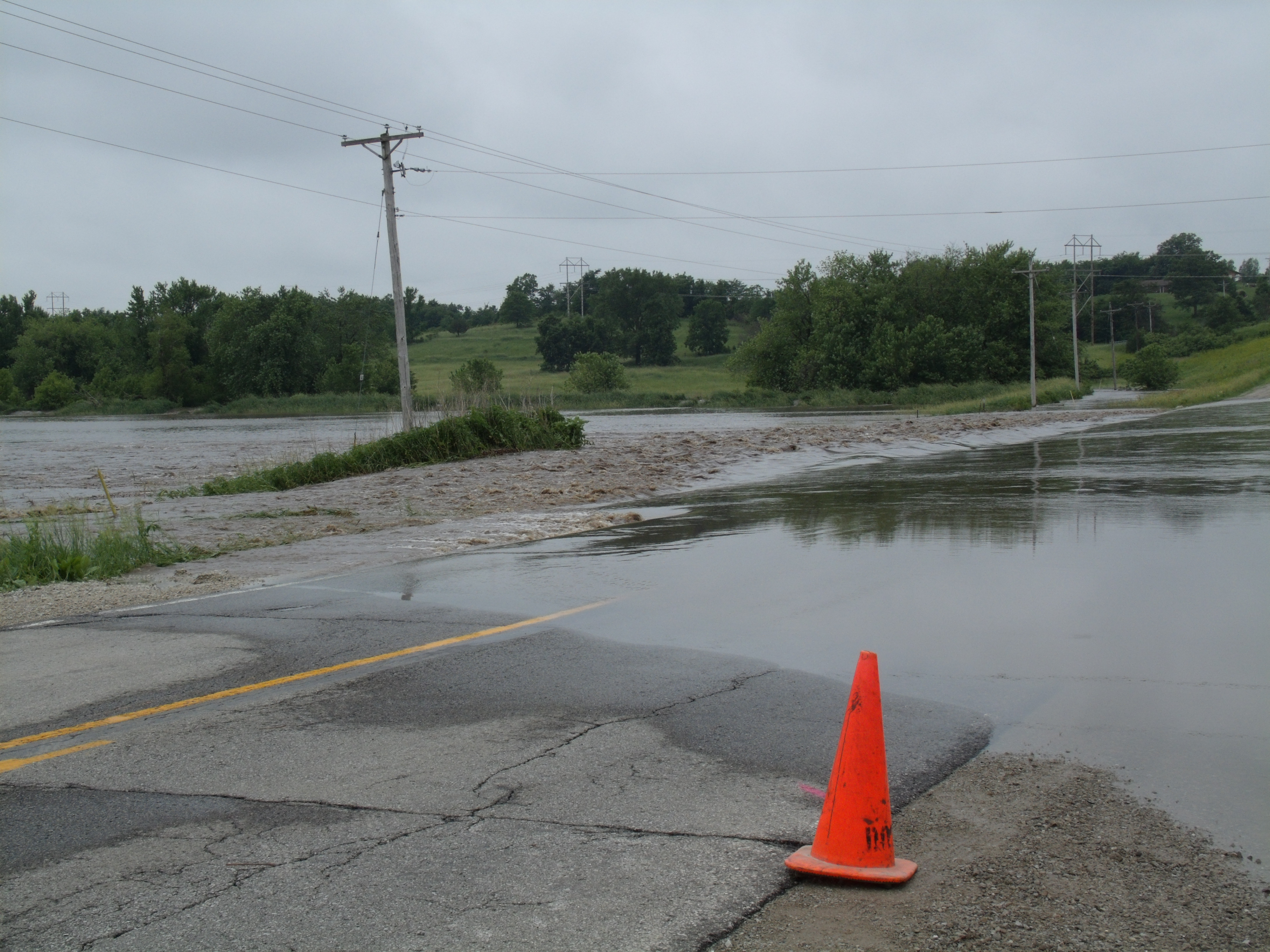Flood Waters are once again rushing over Highway 92 West of Oskaloosa from the Muchakinock Creek