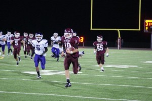 Tyler Hafner seen here checking out on his 65 yard TD run (photo D.Hubbard)