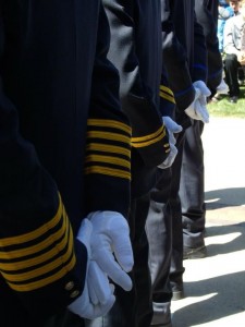 Firefighters stand at parade rest during the 9/11 Memorial Service Sunday afternoon