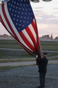 Members of the Oskaloosa Legion helped to raise flags flown over Ground Zero at friday nights football game versus Centerville (photo D.Hubbard)