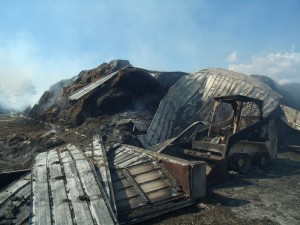This is what remians of the Van Waardhuizen barn that was filled with hay and a Bobcat