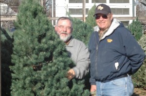 Lance Edwards (left) and Don Swim (right) were helping people pick just the right Christmas tree on Wednesday afternoon