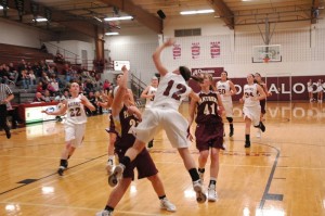 Kena Veldhuizen gets fouled by a Mt. Pleasant Panther during action Tuesday night