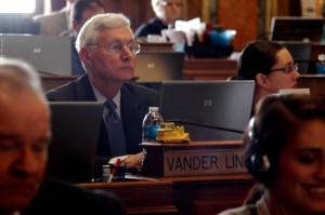 Representative Guy Vander Linden works at his desk in the Iowa House on Wednesday afternoon
