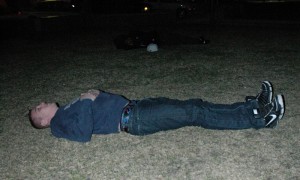 Tyler Schneider plays the 'victim' in a mock mass causality event on the square in downtown Oskaloosa Monday night