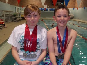 Sophia Dykstra and Carson Breon, 2011-2012 State Swim Team Medalists, placing in the top three at State