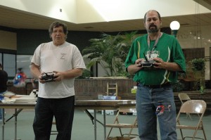 Bob Bratten (left) and Harry Andrews are seen here having some fun with their R/C helicopters