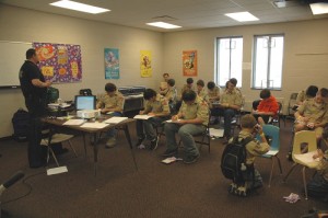 Mahaska County Emergency Manager Jamey Robinson instructs some Boy Scouts in emergency preparedness on Saturday