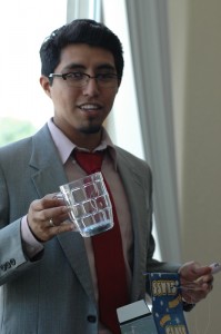 Pennstock Chairman Roy Aguillon shows off some of the items students will receive, like this light up mug