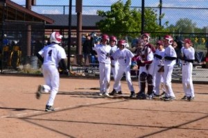 Tanner greeted by his team at home (submitted photo)