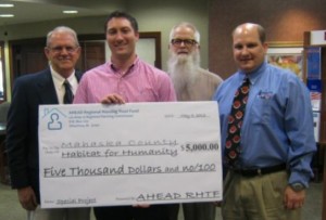 L to R: Ken Rozenboom - RHTF member, Kent Peterson - Mahaska HfH President, Blane Vos – Mahaska HfH Executive Director, and Rob Taylor - RHTF Chairman