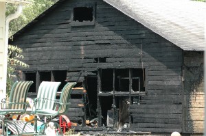This garage at 607 8th Ave West was destroyed by fire on Tuesday. No official cause of the fire is yet listed, but a possible electrical short may be to blame.