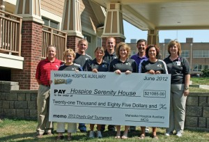 Golf Under the Lights Committee members present a check to MHP Hospice Services for $21,085. Shown are, from left: MCG General Manager Frank Hansen, committee members Cathy Stahl, Paul VanZante, Carol Knoot, Kiley Broadway, Malea Trainer, MHP CEO Jay Christensen, Mary Anderson and MHP Hospice Services Director Kim Lambert. Not shown is committee member Brad Boender.