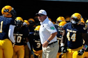 William Penn University Head Coach Todd Hafner leads his team to the field at Homecoming 2012.