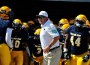 William Penn University Head Coach Todd Hafner leads his team to the field at Homecoming 2012.