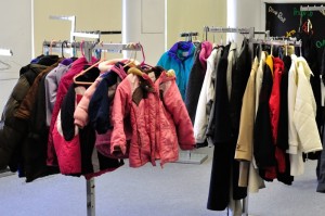 A minimal selection of winter clothing hangs on the coat racks at the Klothes Kloset at The New Hope Community Center. As winter approaches, the need for winter clothing will increase.