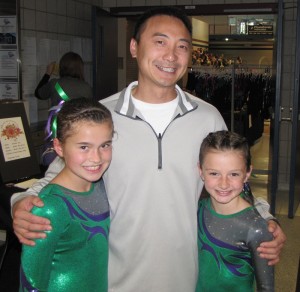 Above are the Level 5 gymnasts (Emily on left, Emma on right) posing with Chow’s Coach and Owner, Mr. Chow. Mr. Chow is the coach of Shawn Johnson and Gabby Douglas. The girls were thrilled to have their picture with him. Picture taken earlier in the season. (submitted photo)