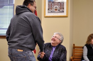 Randy Poe (left) and Kay Swanson (right) share a laugh at Friday's retirement reception.