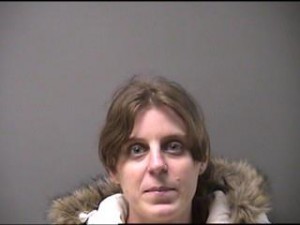 The escapee, Katherine Heredia, has blond hair and a black coat over the pink hoody. She cut off her ankle bracelet. Attached is a photo of her. (Ottumwa PD Photo)