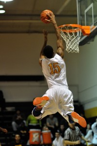 Brandon Beasley launches for another of his signature dunks on Saturday against St. Ambrose.
