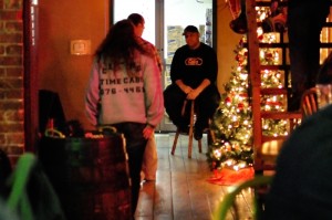Shelly Dilly (left) talks with local bar staff on New Years Eve.