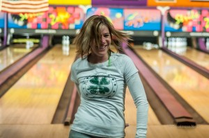 Celebrating a strike at the Friday night MCRF fundraiser. (photo by Ginger Allsup)