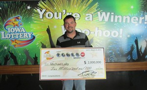 Michael Lally holding his 2 million dollar check. (submitted photo)