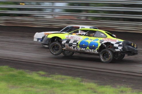 The Jeff Joldersma Racing entry pulls the front tire high into the air on a night the track was getting lots of traction. photo by Denis Currier/Oskaloosa News
