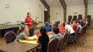 Participants of the Mahaska County 4-H Bug Zoo Day Camp learning about entomology from the ISU Insect Zoo coordinator. (submitted photo)