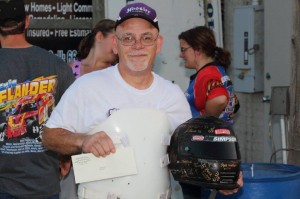 Mark Widmar was presented with a check to help offset medical expenses as a result of an on track accident earlier this year at the Southern Iowa Speedway. (photo by Denis Currier)