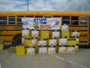 Needed school supplies are stacked up in front of an Oskaloosa school bus Wednesday as 'Stuff the Bus' came to an end. (submitted photo)