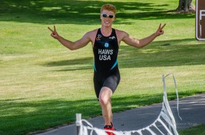 Hunter Haws of Des Moines crosses the finish line at Saturday's OFC inaugural triathlon.