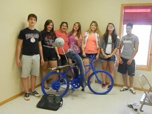 Volunteers help decorate this bike for MCRF. (submitted photo)