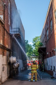 Oskaloosa Firefighters hose down the side of Mi Ranchito Mexican Restaurant on Sunday afternoon.