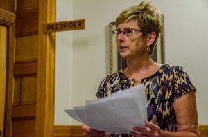 Mahaska County Auditor Sue Brown reads the results of the September 10, 2013 school board election.