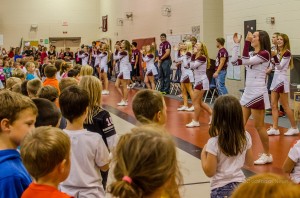 Oskaloosa Cheerleaders lead the assembly in a few cheers to help get kids moving.