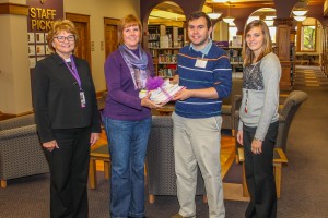 The Oskaloosa Public Library is one of four local libraries receiving bereavement books donated by the Mahaska Hospice Auxiliary. Shown at the book presentation are, from left: MHP Social Worker Julie Glass; Mahaska Hospice Past President Diane Davis; Oskaloosa Public Library Director William Ottens; and MHP Home Health and Hospice Director Anne Hildreth.