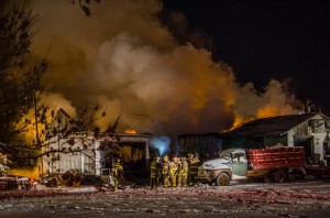 Firefighters work the scene of a structure fire in Hedrick on Sunday night.