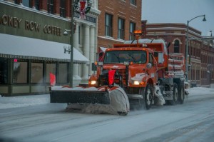 Iowa Department of Transportation snow plow as it goes through downtown Oskaloosa.