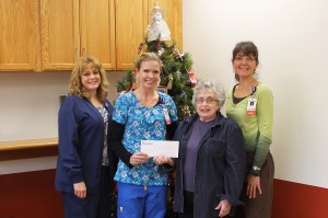 The Mahaska Health Partnership Cancer Care and Infusion Center (CCIC) raised $1,060 from their Annual Christmas Basket Auction. Proceeds were designated to the Ecumenical Food Cupboard in Oskaloosa. Shown at the check presentation are, from left MHP CCIC Nurses Sally Blake and Jessie Bihn, Ecumenical Food Cupboard Manager Shirley Frey and CCIC Nurse Sandy Long.