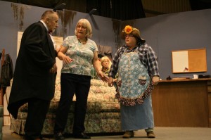 Mrs. Moss (Martha Scharff) talks with Rhett the butler (Donnie Zook) and Nellen Voyd (Dollie Horn) about the activities at Moss Manor. The conversation takes place at the Fremont School in the annual Fremont Community Theatre Production of “The Moss Trap. The show is sponsored by the Fremont Lions Club. Show times are 7 p.m. Thursday-Saturday, Feb. 6-8 and 2 p.m. on Sunday. (submitted photo)