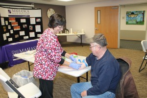 Joe Warrick of Oskaloosa had his blood drawn by Phlebotomist Janet Braden at Mahaska Health Partnership’s annual Community Cholesterol Screening on Tuesday, Feb. 11. According to the American Heart Association, all adults age 20 and older should have their cholesterol checked at least once every five years to help detect indicators for heart disease, heart attack and stroke. MHP offered reduced-rate cholesterol screenings at its Oskaloosa campus and at New Sharon Medical Center in recognition of National Heart Month. (submitted photo)