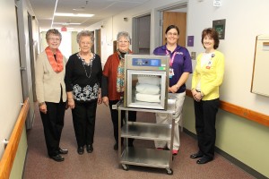 The MHP Hospital Auxiliary recently purchased a blanket warmer for the Inpatient Geriatric Psychiatry Department at MHP. Shown with the blanket warmer are, from left: MHP Hospital Auxiliary Members Joyce Cline, Mary Ann VanKooten and Carole Comstock, IPG Certified Nursing Aide Darcie Russell and Garvis. (submitted photo)