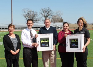 Two AEDs were purchased for the Lacey Recreation Complex with proceeds from fundraisers sponsored at Mahaska Health Partnership in recognition of National Heart Health Month.  Shown at Lacey are, from left: MHP Marketing and Development Director Cathy Stahl, MHP CEO Jay Christensen, Mahaska Community Recreation Foundation Board President John Pothoven and Executive Director Sherry Vavra, and MHP Cardiac Rehabilitation Nurse Renee Edgar.