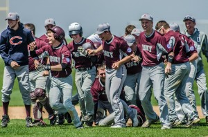 The Oskaloosa Sr. Babe Ruth team celebrates after defeating Twin Cedars on Sunday.