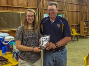 Meghan Roozenboom receives a plaque from the Y for her selection as the May honored student of the month at the Y’s Men’s Club Annual Potluck Meeting. (submitted photo)