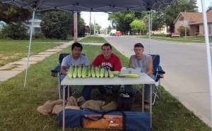 Austin Lanphier, Colter Lanphier and Dakota Hudnut are selling sweet corn along A Ave for their FFA project.